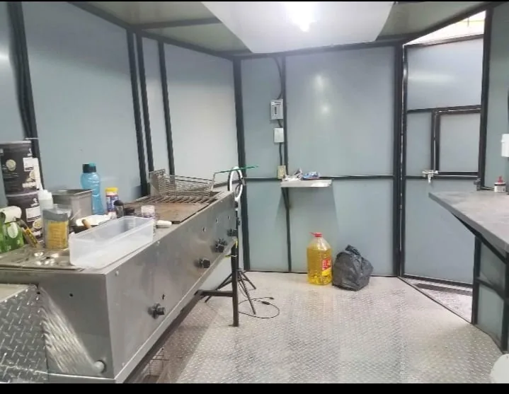 Interior: flat-top griddle with fryer basket, sink and work counters